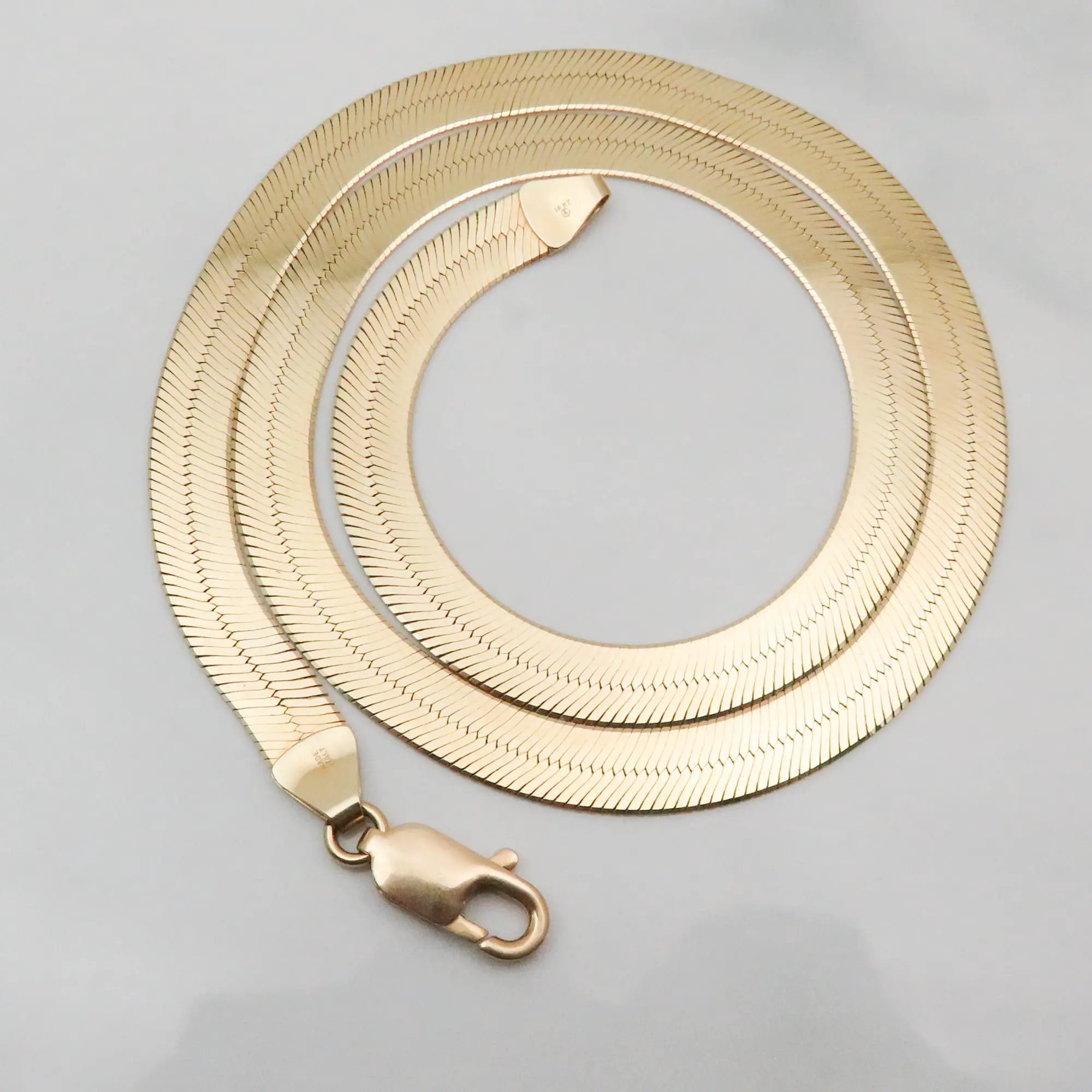 18 1/2 Inch 14 Karat Gold 7 mm Herringbone Chain